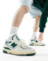 New Balance 550 trainers in off white and green