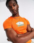 Фото #1 товара COLLUSION shrunken fit t-shirt with surf print in orange