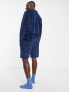 ASOS DESIGN pyjama set in navy ribbed velour with polo long sleeve top and shorts