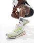 adidas Running Supernova Stride trainers in off white and lime