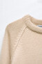 Short plain knit sweater
