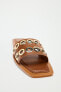 Flat leather slider sandals with metal appliqués