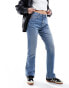 Фото #2 товара ASOS DESIGN mid rise straight jeans in mid blue