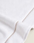 Embroidered scalloped edge towel