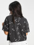 ASOS DESIGN boxy high neck tee in daisy embroidery in washed charcoal