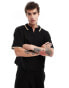 ASOS DESIGN coord oversized knitted polo shirt with contrast tipping in black