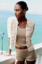 Woven knit cardigan with short sleeves