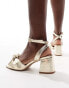 ASOS DESIGN Hansel knotted mid heeled sandals in gold