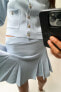 Box pleat knit mini skirt