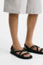 Sandals with criss-cross straps