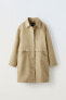 Trench coat with snap buttons