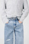 Balloon carrot fit jeans with belt