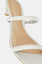 Leather high-heel sandals with tubular straps