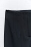 Trousers with visible seams