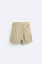 Creased-effect bermuda shorts