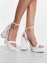 Glamorous platform heel sandals in white patent