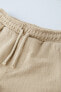 Textured plush bermuda shorts