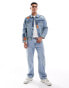 Levi's – The Trucker – Jeansjacke in Mittelblau mit geflicktem Used-Design