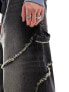 COLLUSION Unisex – Weit geschnittene Jeans in verwaschenem Schwarz mit freiliegender Ziernaht