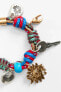 CHARM COLOURED CORD BRACELET