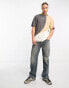 Karl Kani – Oversize-T-Shirt mit Farblock-Design in Beige und Schwarz mit kleinen Markenlogo