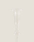 Raised design glass candlestick