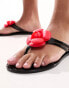 South Beach flower flip flops in black with red rose