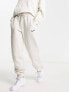 Фото #1 товара Nike Midi Swoosh phoenix fleece joggers in light orewood brown