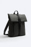 Rubberised backpack with flap