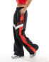 Nike Streetwear woven trackpant in black and red