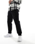 Another Influence relaxed fit tapered cargo trousers with ankle toggle in black