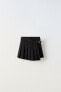 Box pleat skirt with buckle