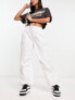 Фото #1 товара Bershka tie waist nylon cargo parachute trousers in white