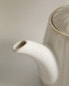 Stoneware teapot with raised design