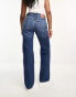 Levi's low rise ripped knee jeans in mid blue