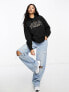 Tommy Jeans relaxed luxe varsity logo hoodie in black