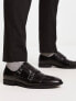 ASOS DESIGN monk shoes in black faux leather with emboss panel