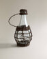 Glass bottle with rattan stopper