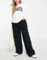 Фото #1 товара ASOS DESIGN Curve oversized cargo trouser with multi pocket in black