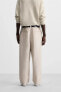 RELAXED FIT PLEATED TROUSERS