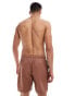 ASOS DESIGN swim shorts in mid length with cargo pocket detail in brown