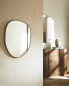Small asymmetric wall mirror