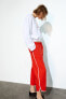 Cropped trousers with side stripe