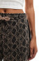 Monki drawstring wide leg trousers in brown snake print with black side stripe detail