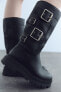 Track ankle boots with buckles