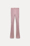 FADED-EFFECT RIBBED FLARED TROUSERS