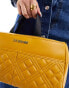 Love Moschino top handle quilted bag in mustard