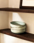 Porcelain bowl with antique finish rim