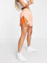 Jordan Essential skort in crimson bliss and orange