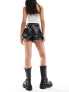 ASOS DESIGN leather look turn up utility shorts in black